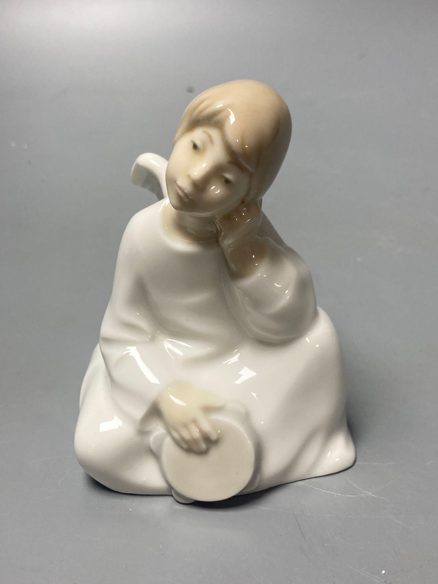 Three Lladro figures, largest 29cm, A Nao seated cherub and a Beswick horse